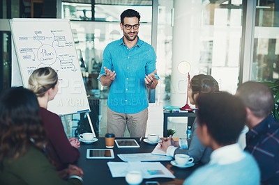 Buy stock photo Cropped shot of a young businessman giving a presentation