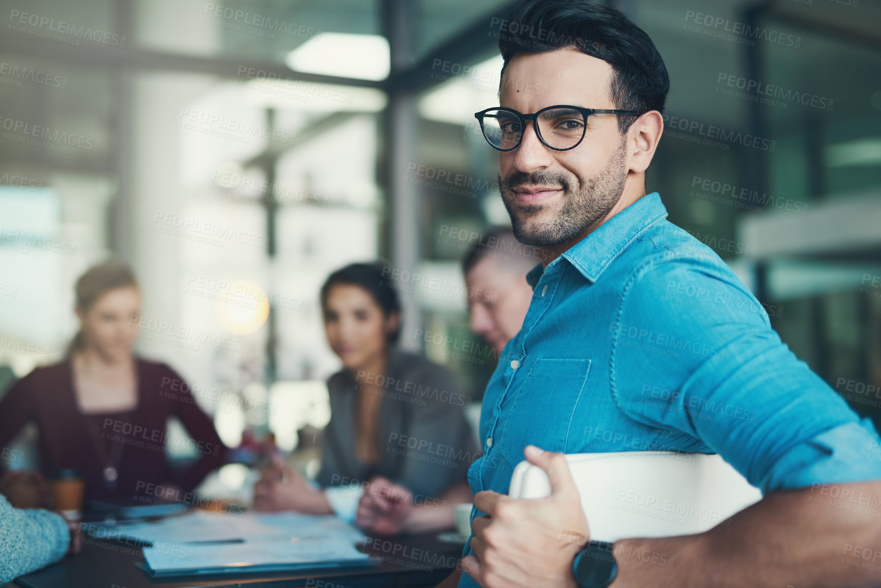 Buy stock photo Man, boardroom and meeting with portrait at startup with team, colleagues and documents for discussion. Person, employee and happy with group, staff and creative for problem solving at media agency