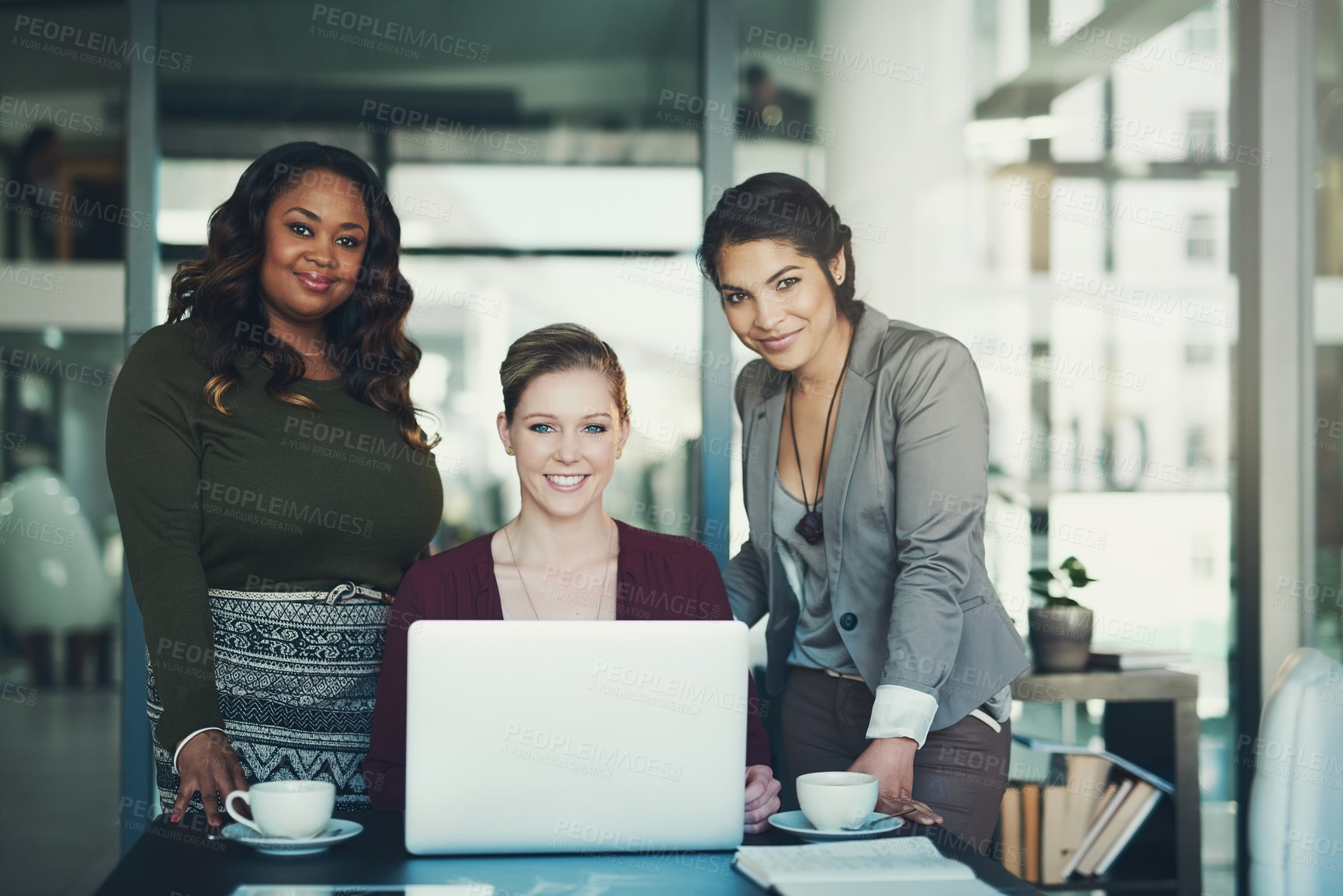 Buy stock photo Cropped portrait of three businesswoman gathered around a laptop in the office
