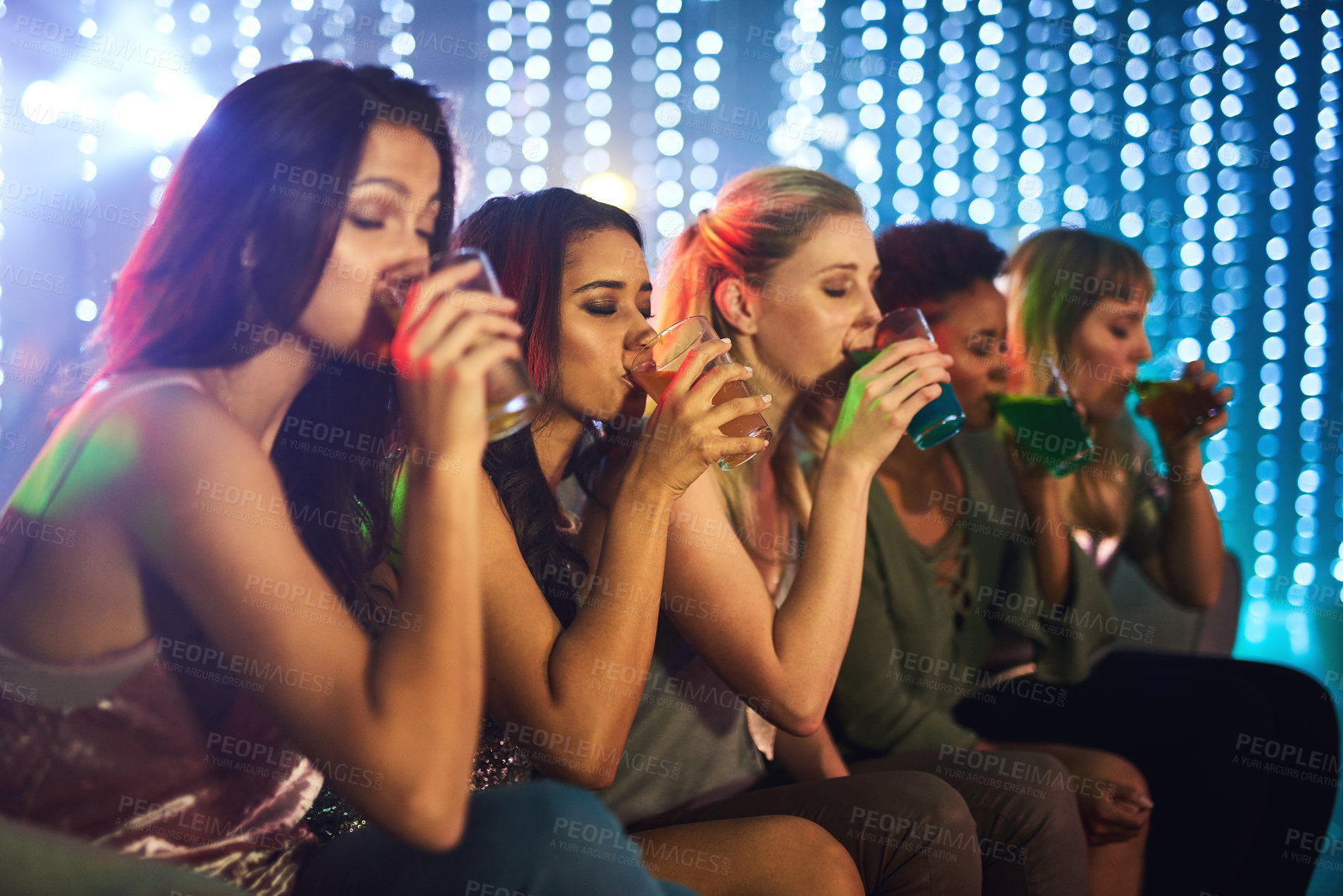 Buy stock photo Friends, woman and drinking in nightclub together, night life and fun for celebration or new years party with alcohol shots. Festival, disco lights and social or cocktails, line up group and beverage