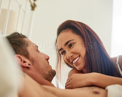 Buy stock photo Couple, holding and cuddle in bed with love after morning wake up for relationship or bond together in house. Man, woman and happy in bedroom with blanket, pillow and sheets for dating or romance 