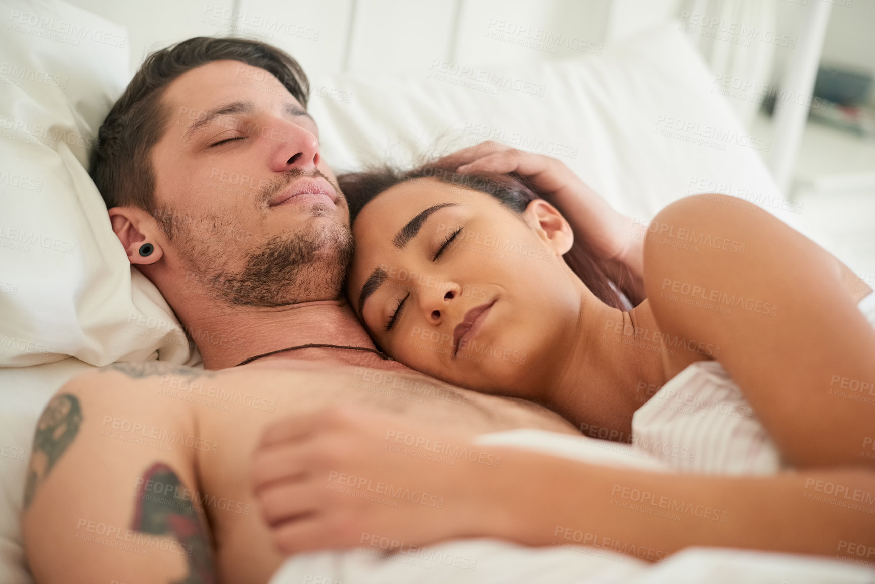 Buy stock photo Couple, sleeping and together in bed for hug, romance and love in bedroom. Man, woman and relaxed at home for cuddle, security and rest in living space for comfort and bonding in marriage or relation