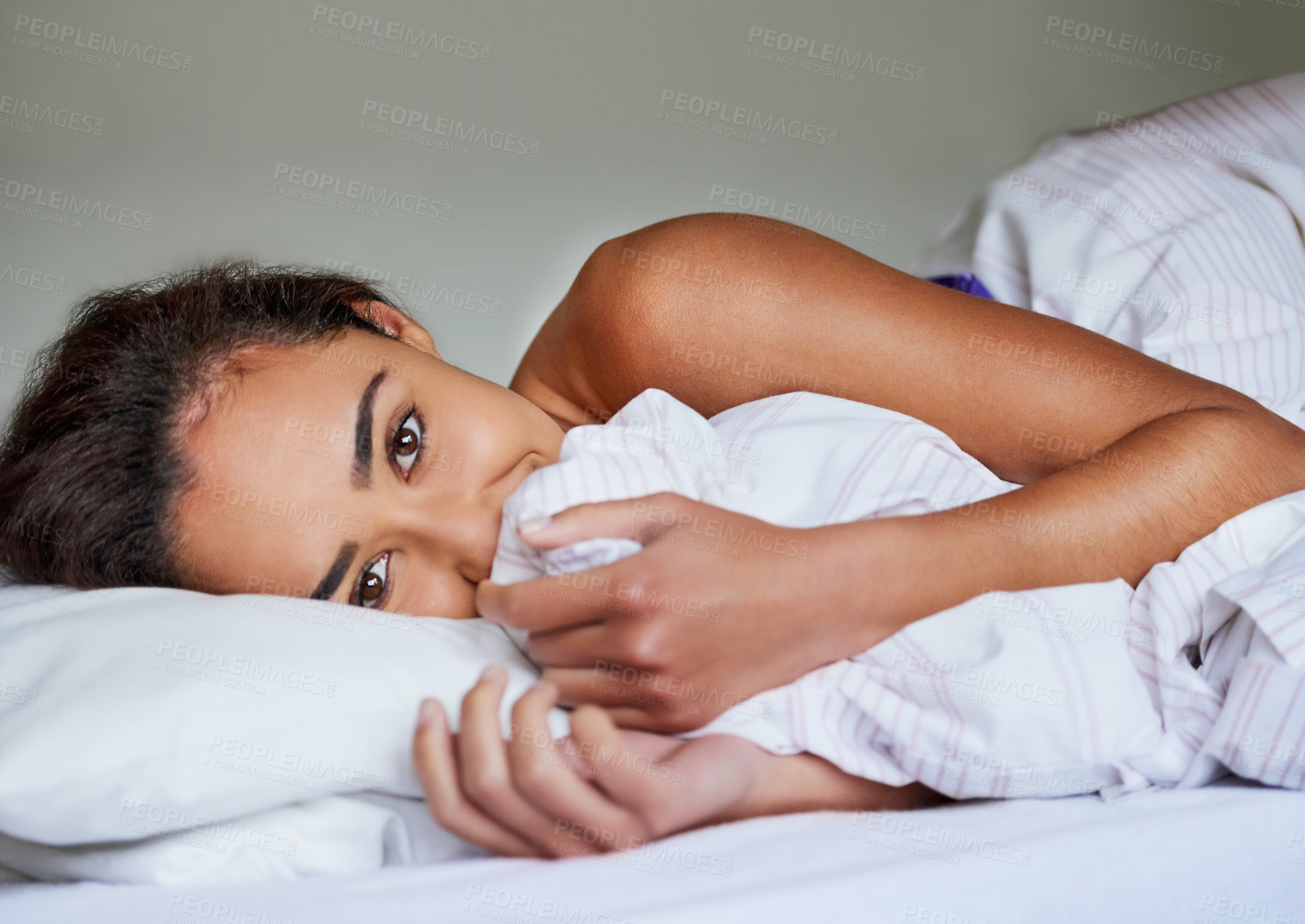 Buy stock photo Portrait of a beautiful young woman cuddling blankets in her bed at home