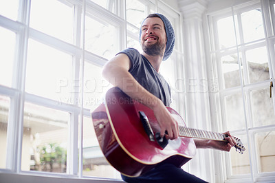 Buy stock photo Home, smile and man with guitar, music and play with skills for sound, art and ready for performance in show. Record, equipment and artist with instrument, hands and creative with fingers and solo