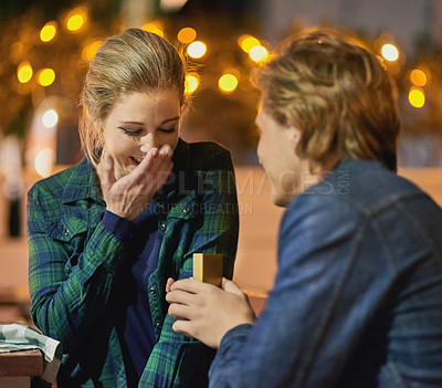 Buy stock photo Cropped shot of a young man proposing to his girlfriend