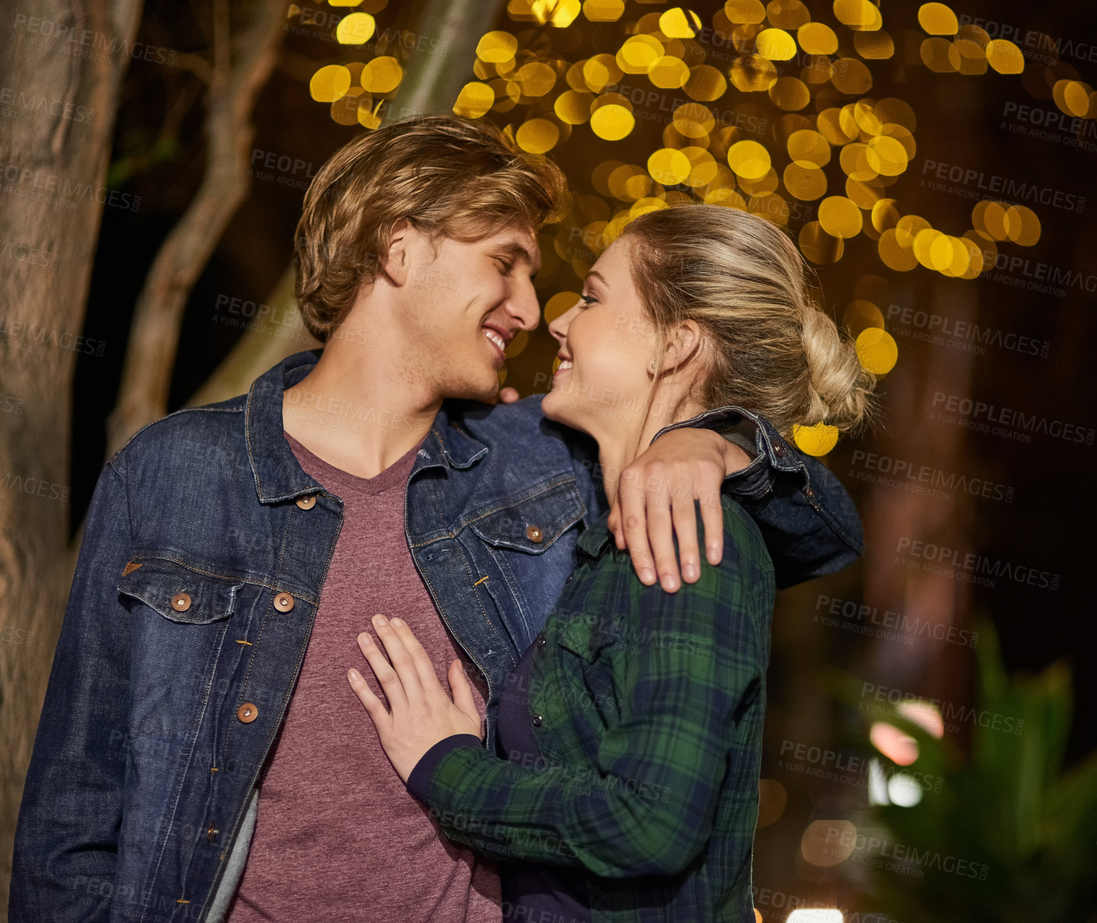 Buy stock photo Couple, happy and kiss in outdoor, night and lights for love, city and romance. Bonding, smile and people in date, relationship and walking while together, affection and spark for commitment