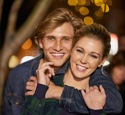 Buy stock photo Portrait, smile and couple hug on night date out in the city together for romance or celebration. People, boyfriend and girlfriend embrace outside for bonding, connection or love and affection