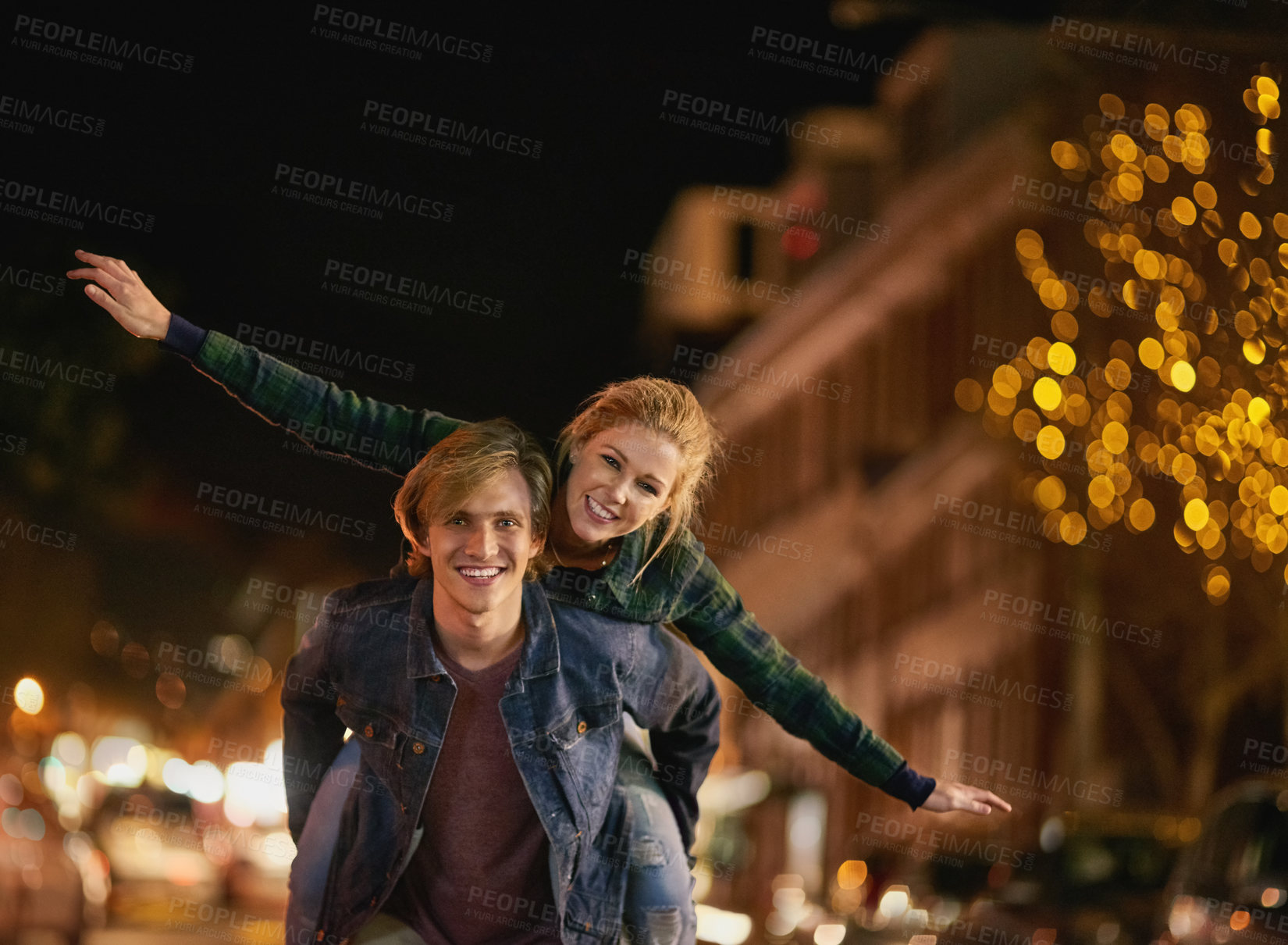 Buy stock photo Shot of a young couple out on a date in the city