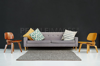 Buy stock photo Grey sofa, pillows and chairs in room for interior design with minimalism aesthetic for relaxation. Mockup, furniture and reception area layout with carpet in studio with home improvement in Germany.