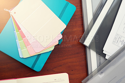 Buy stock photo High angle shot of color swatches and paperwork on a desk