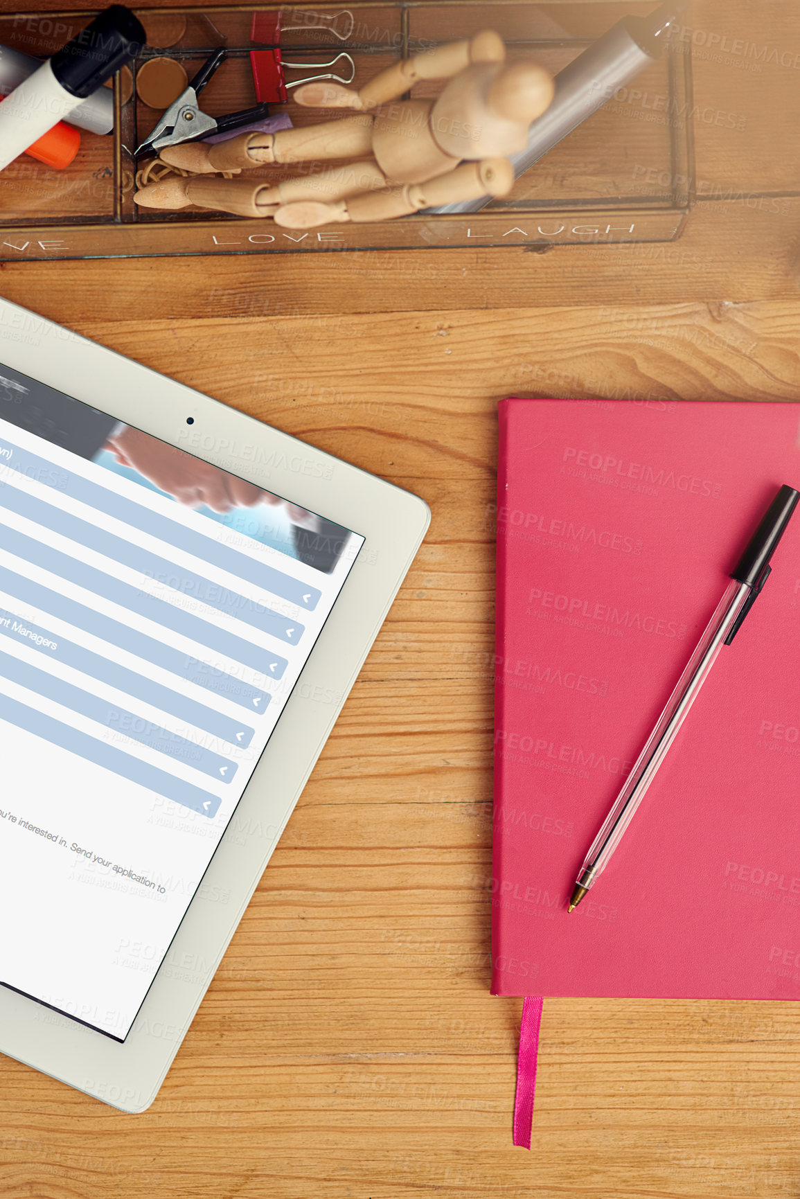 Buy stock photo High angle shot of a digital tablet and notebook on an office desk