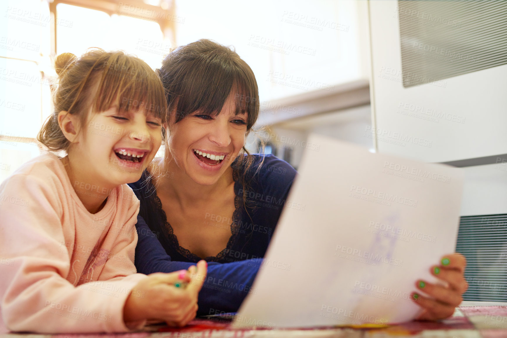 Buy stock photo Cropped shot of a mother and daughter colouring in together at home