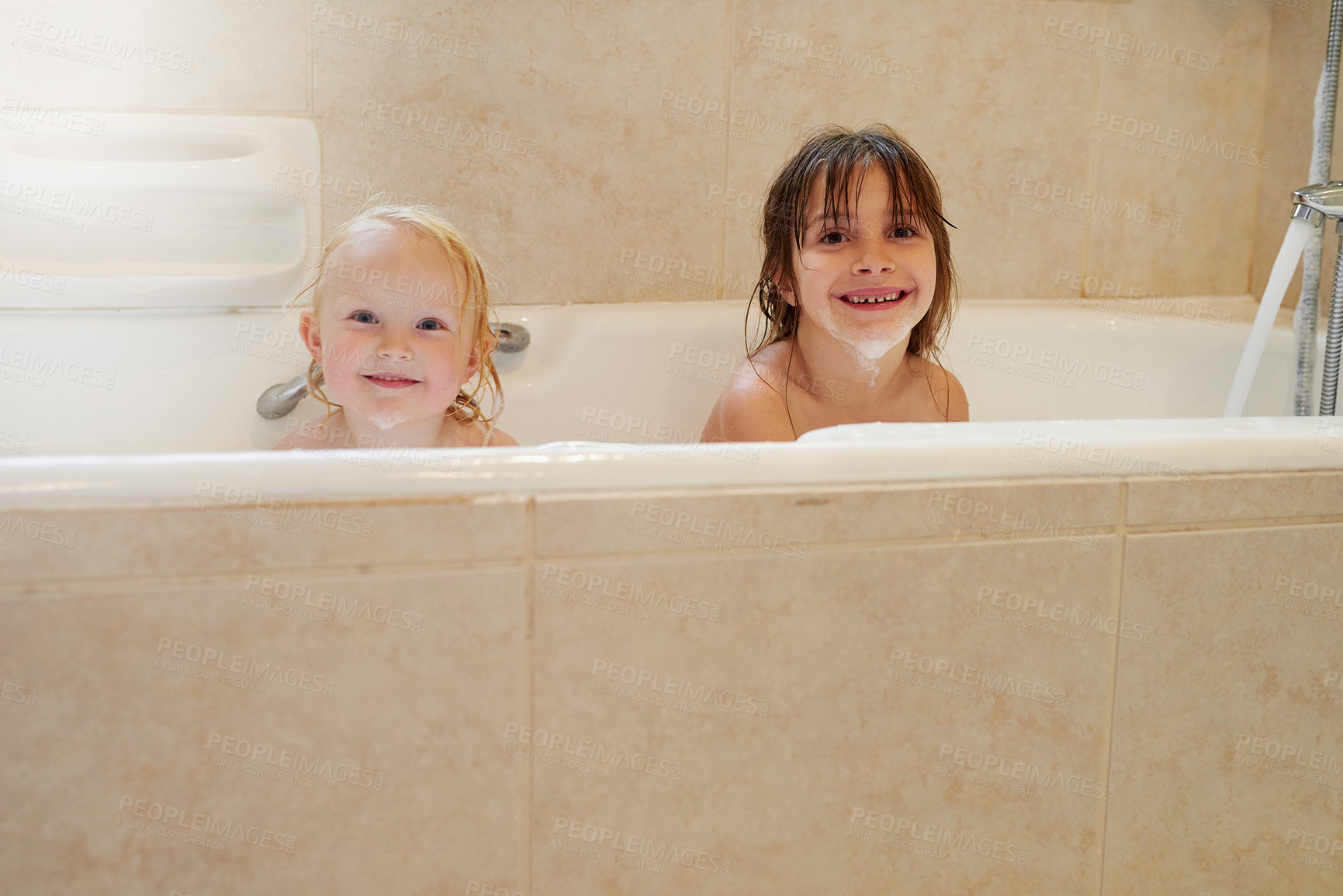 Buy stock photo Portrait, bathtub and happy kids in water for hygiene, health or wellness in bathroom. Foam, soap and face of children bathing, cleaning skin and cute siblings washing with bubbles in home together