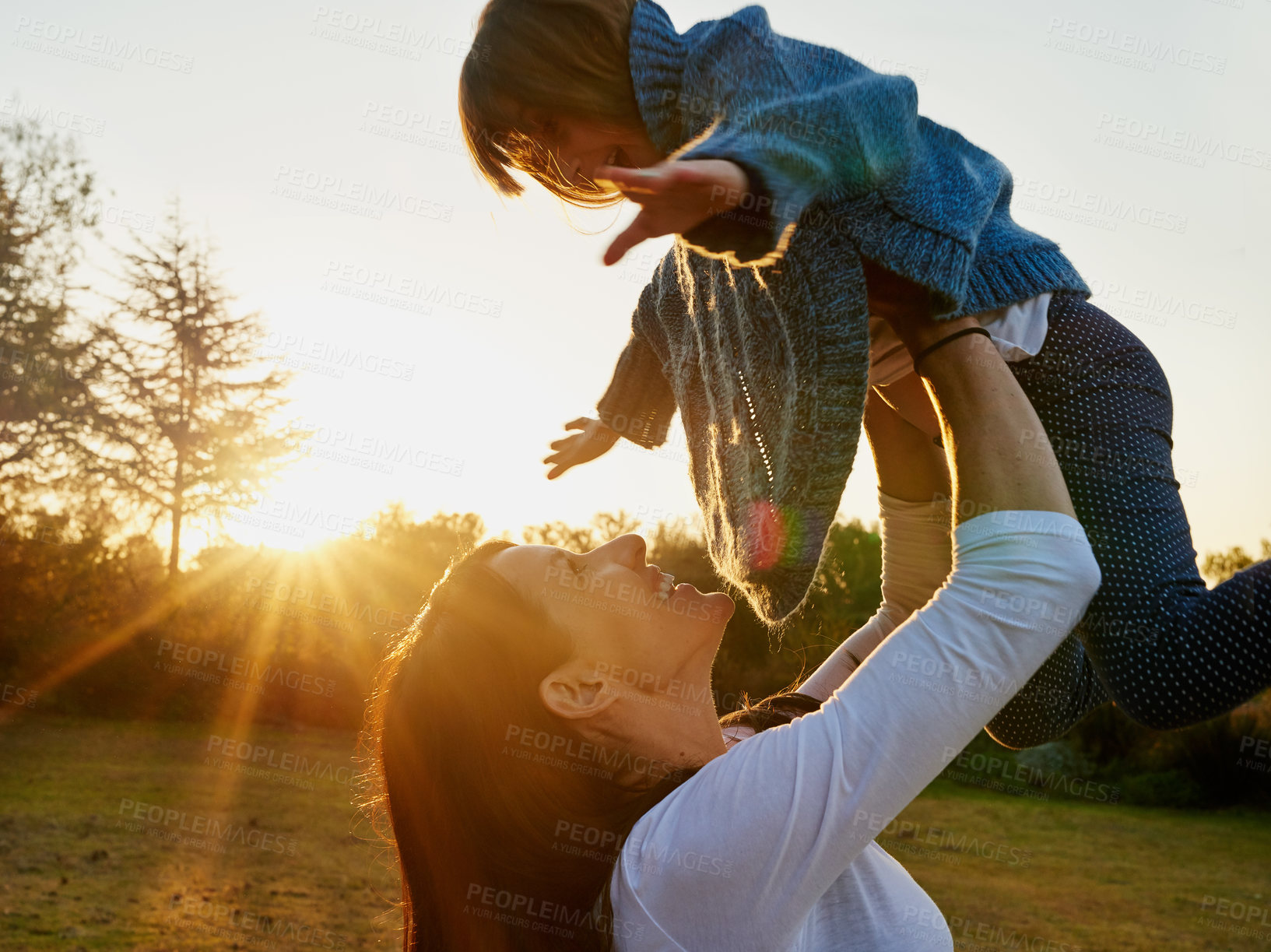 Buy stock photo Mother, girl and flying in outdoor nature, laugh and play together for bonding in backyard. Woman, daughter and game in park for love and care in garden, sky and support or security in parenthood