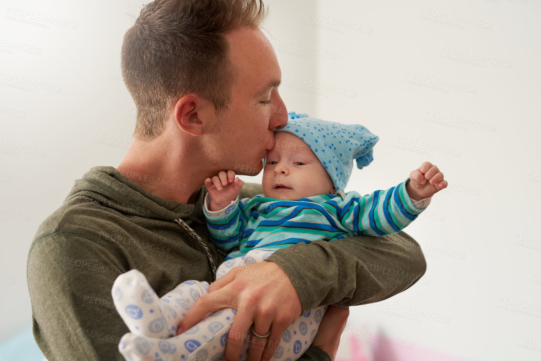 Buy stock photo Cropped shot of a father bonding with his baby boy at home