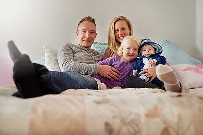 Buy stock photo Portrait of a happy family spending quality time together at home