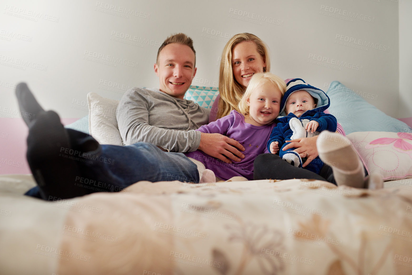 Buy stock photo Portrait of a happy family spending quality time together at home