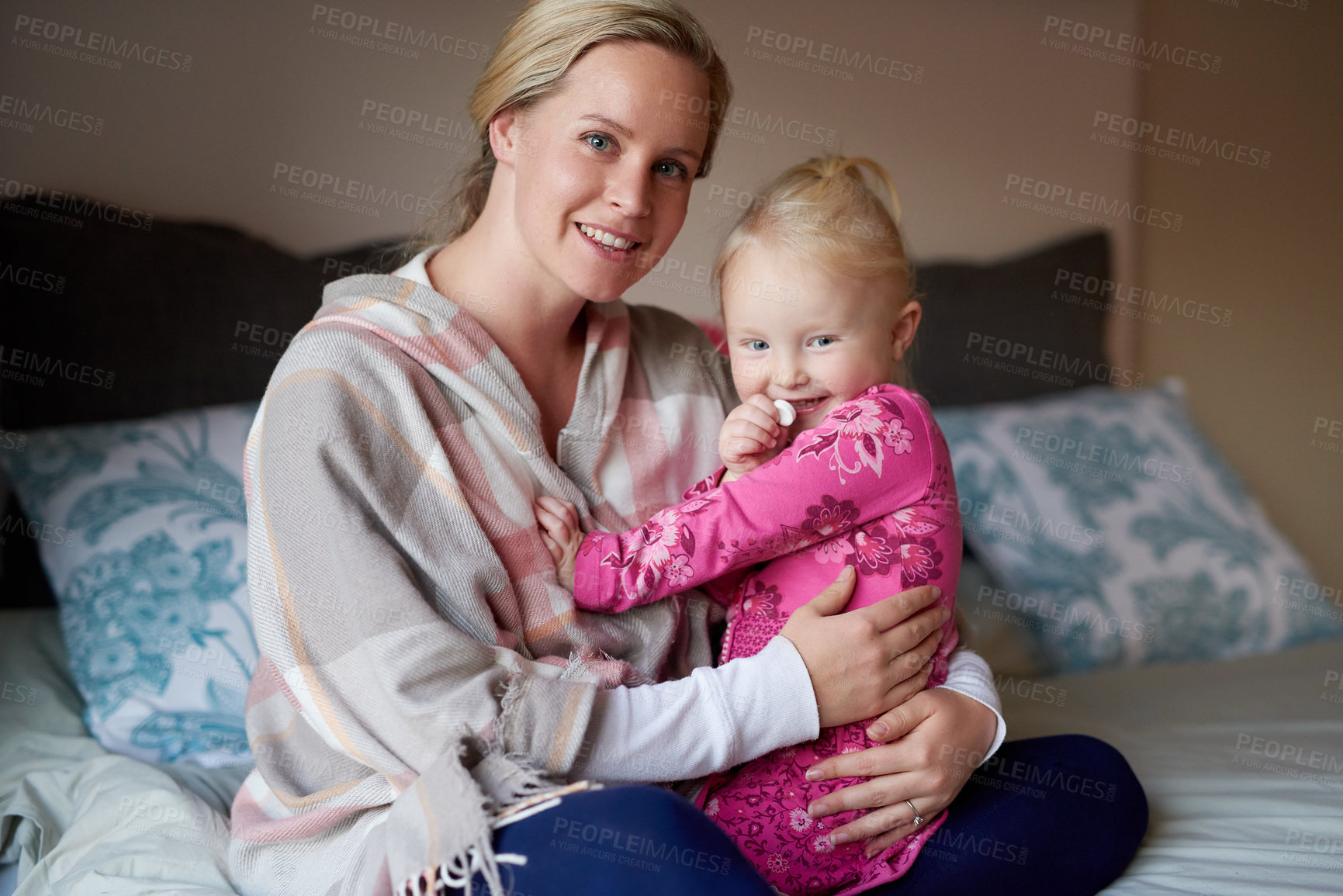 Buy stock photo Mother, girl and bed in home for portrait, hugging and care for childhood development and bonding or growth with mama. Child, daughter and smile or happy in bedroom, together and family relationship