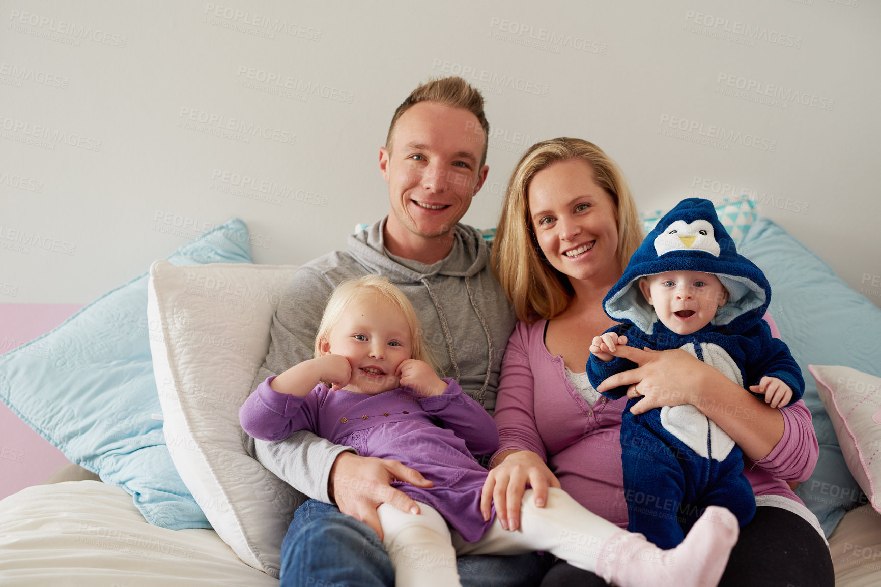 Buy stock photo Portrait of a happy family spending quality time together at home