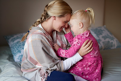 Buy stock photo Cropped shot of a mother and daughter spending quality time together at home