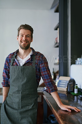 Buy stock photo Cropped portrait of a young man standing in his coffee shop