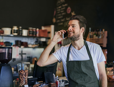 Buy stock photo Man, barista and phone call for communication in coffee shop for hospitality, take away and bistro server. Male employee, small business and customer service in cafe for technology and food service 