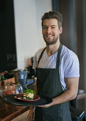 Buy stock photo Cropped portrait of a young waiter taking an order to a customer