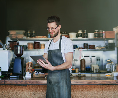 Buy stock photo Man, barista and tablet for contact or delivery in coffee shop for hospitality, take away and employee in bistro. Male person, small business and technology for customer service, cafe and food sales 