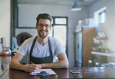 Buy stock photo Cropped portrait of a young barista working in his coffee shop