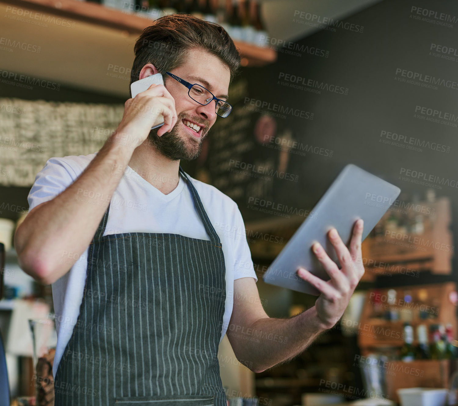 Buy stock photo Man, barista and phone call for online order, communication and hospitality, take away and bistro server. Male employee, small business and customer service in cafe for technology and food delivery