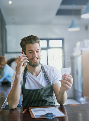 Buy stock photo Barista, order and coffee shop with phone call, admin and clipboard or supplier, cafe and male manager. Small business, entrepreneur and checklist or review, inventory and contact in communication