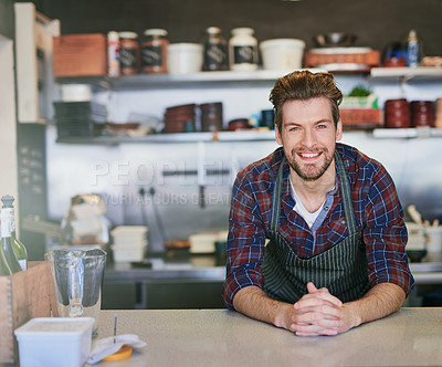 Buy stock photo Cafe, cashier and counter for man, portrait and friendly in small business, smile and retail in store. Confidence, coffee shop and happiness of entrepreneur, apron and uniform for service of barista