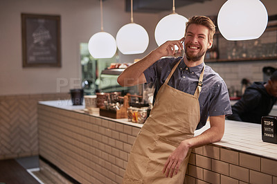 Buy stock photo Man, coffee shop or cafe phone call with smile for contact, deal and beverage order at small business. Happy, barista or waiter mobile in kitchen for conversation, networking and customer service