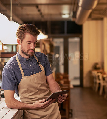 Buy stock photo Man, coffee shop or cafe with tablet for contact, online deal or beverage order at small business. Restaurant, barista or waiter in kitchen with tech for communication, networking or customer service