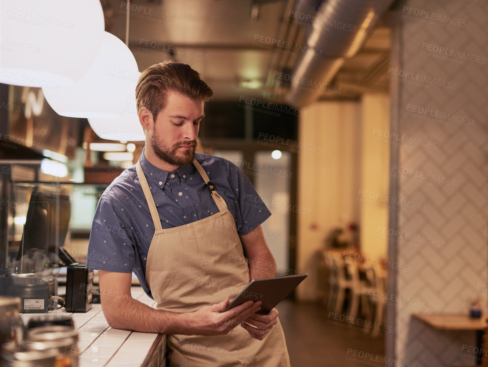 Buy stock photo Man, coffee shop or cafe with tablet for contact, online deal or beverage order at small business. Restaurant, barista or waiter in kitchen with tech for communication, networking or customer service