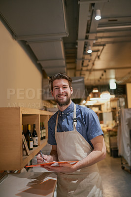 Buy stock photo Man, clipboard and inventory on shelf in restaurant for alcohol, wine and management for stock. Male cafe owner, paperwork and sale for small business, pub and entrepreneur in service industry 