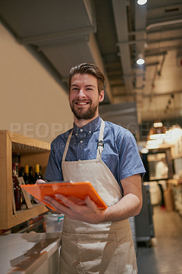 Buy stock photo Happy man, clipboard and portrait with wine on shelf in restaurant for inventory, management and hospitality. Male cafe owner, paperwork and smile for small business, pub and entrepreneur with pride