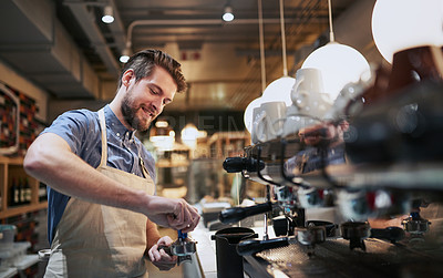 Buy stock photo Cropped shot of a handsome young man working in a cafe