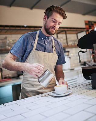 Buy stock photo Man, jug and cup in cafe for espresso with hospitality service, small business and professional machine for drink. Apron, metal container and male barista or waiter in coffee shop for sales and work
