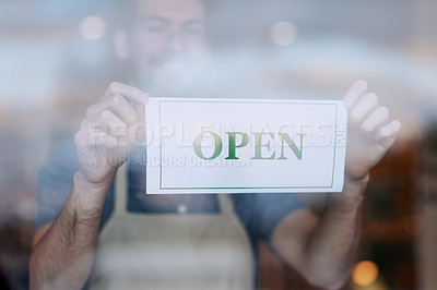 Buy stock photo Cropped shot of a young businessman opening his cafe