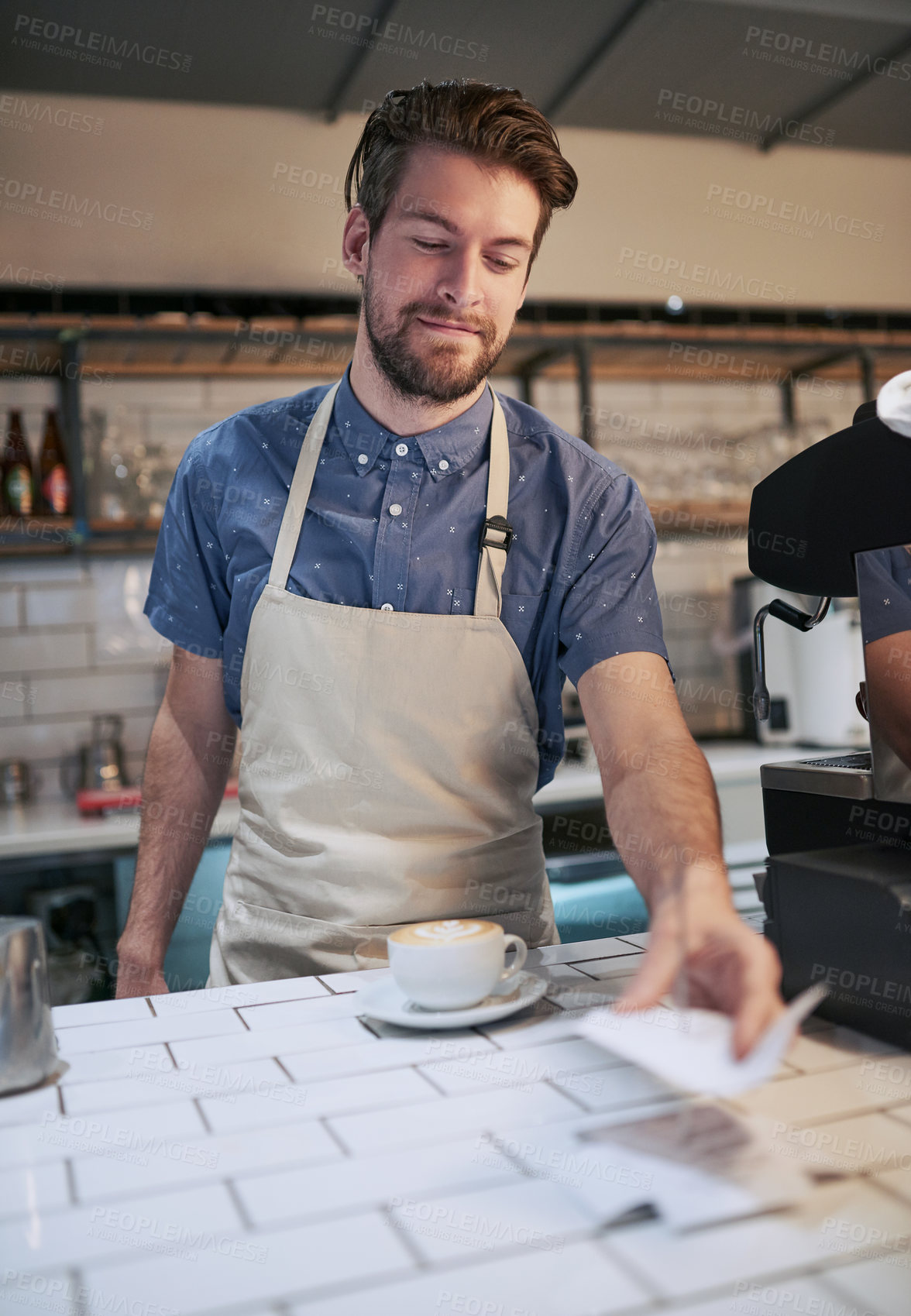 Buy stock photo Man, receipt and coffee in cafe for payment with hospitality service, small business and professional machine for drink. Apron, paper slip and male barista or waiter in restaurant for sales and work