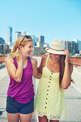 Buy stock photo Shot of best friends having a good time out in the city