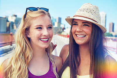 Buy stock photo Shot of best friends having a good time out in the city