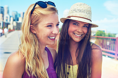 Buy stock photo Shot of best friends having a good time out in the city