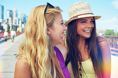 Buy stock photo Shot of best friends having a good time out in the city