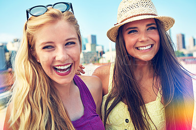 Buy stock photo Shot of best friends having a good time out in the city