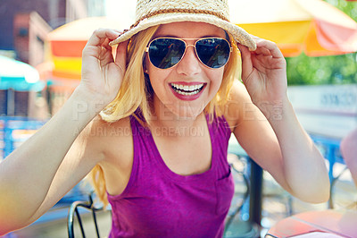 Buy stock photo Portrait of an attractive young woman sitting at an outdoor cafe