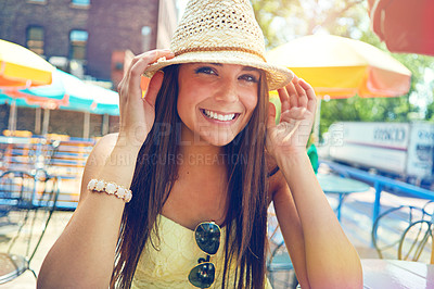 Buy stock photo Portrait of an attractive young woman sitting at an outdoor cafe