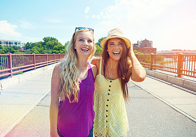 Buy stock photo Shot of best friends having a good time out in the city