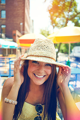 Buy stock photo Portrait of an attractive young woman sitting at an outdoor cafe